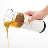 ADJUSTABLE MEASURING CUP